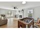 Spacious living room with fireplace, hardwood floors, and a foosball table at 2315 Lawton Bluff Rd, Charlotte, NC 28226