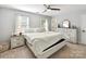 Bright main bedroom featuring neutral walls, carpet floors, ceiling fan and natural light from windows at 2315 Lawton Bluff Rd, Charlotte, NC 28226