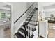 Staircase featuring black and white accents, leading to the upper level of the home at 2315 Lawton Bluff Rd, Charlotte, NC 28226