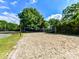Sandy volleyball court with net set up, perfect for a friendly game at 2315 Lawton Bluff Rd, Charlotte, NC 28226