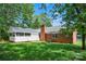 Spacious backyard with brick house, screened porch and lush lawn at 2502 Gold Rush Dr, Lincolnton, NC 28092