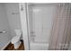 Bathroom with toilet and shower-tub combo with neutral shower curtain at 2502 Gold Rush Dr, Lincolnton, NC 28092