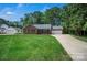 Charming brick home with well-manicured lawn, mature trees and attached garage at 2502 Gold Rush Dr, Lincolnton, NC 28092