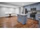 Open concept kitchen and dining area featuring stainless steel appliances and granite countertops at 2502 Gold Rush Dr, Lincolnton, NC 28092