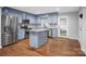 Well-appointed kitchen featuring stainless steel appliances, granite countertops, and ample storage in the blue cabinets at 2502 Gold Rush Dr, Lincolnton, NC 28092