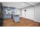 Stylish kitchen with blue cabinets, granite countertops, stainless steel appliances, and hardwood flooring at 2502 Gold Rush Dr, Lincolnton, NC 28092