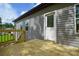 The back deck has light wood, gray siding, white trim, and a partial view of the well-kept neighborhood at 2706 Lyla Ave, Concord, NC 28027