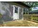 Exterior view of a home featuring a newly constructed wooden deck and access door at 2706 Lyla Ave, Concord, NC 28027