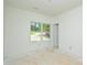 A room with a window for natural light and a glimpse of the outdoor environment at 2706 Lyla Ave, Concord, NC 28027