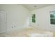 A room featuring a window, providing natural light and view of the outdoor environment at 2706 Lyla Ave, Concord, NC 28027