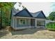View of the home showing gray siding and a two car garage at 2706 Lyla Ave, Concord, NC 28027