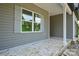 Covered porch featuring gray siding, a window, and a support column at 2706 Lyla Ave, Concord, NC 28027