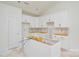 In-progress kitchen with white cabinetry and unfinished island at 2706 Lyla Ave, Concord, NC 28027