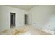 An open room with fresh white paint, and two doorways, ready for personalization at 2706 Lyla Ave, Concord, NC 28027