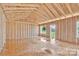 Unfinished construction shows the wood framework, window placement, and subflooring at 2706 Lyla Ave, Concord, NC 28027