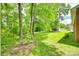 Lush backyard features mature trees and a storage shed and ample privacy at 2833 Regency Rd, Lancaster, SC 29720
