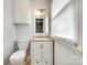 Well-lit bathroom with a single vanity, granite counter and a bright, natural light at 2833 Regency Rd, Lancaster, SC 29720