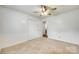 Bright bedroom with neutral carpet, wainscoting, and a ceiling fan for a cozy atmosphere at 2833 Regency Rd, Lancaster, SC 29720