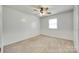 Neutral bedroom with wall wainscoting, carpet flooring, ceiling fan, and natural light from window at 2833 Regency Rd, Lancaster, SC 29720