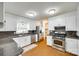 Bright kitchen with stainless appliances, granite countertops, and white cabinetry at 2833 Regency Rd, Lancaster, SC 29720