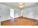 Spacious living room featuring hardwood floors, natural light, and a ceiling fan at 2833 Regency Rd, Lancaster, SC 29720