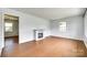 Inviting living room with hardwood floors and a decorative fireplace at 2833 Regency Rd, Lancaster, SC 29720