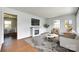 Bright living room features a modern fireplace, updated flooring, and lots of natural light at 2833 Regency Rd, Lancaster, SC 29720