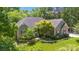 Aerial view of the single-Gathering home with mature landscaping, offering privacy and curb appeal at 2923 Meadow Creek Ln, Monroe, NC 28110