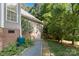 This is the backyard of the home, with lush landscaping and natural light at 2923 Meadow Creek Ln, Monroe, NC 28110