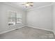 A simple bedroom with neutral colors offers a blank canvas for personalized decoration at 2923 Meadow Creek Ln, Monroe, NC 28110