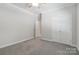 Neutral bedroom with large closet and overhead fan offers a calm, uncluttered space at 2923 Meadow Creek Ln, Monroe, NC 28110