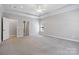 Spacious main bedroom suite with carpet flooring, crown molding, and ceiling fan at 2923 Meadow Creek Ln, Monroe, NC 28110