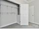 Walk-in closet equipped with shelving provides substantial storage at 2923 Meadow Creek Ln, Monroe, NC 28110