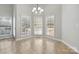 Bright dining nook with tile floors, pendant light, and large sunny windows with blinds at 2923 Meadow Creek Ln, Monroe, NC 28110