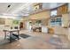 A large garage space with concrete floors and multiple windows, with worktables and storage at 2923 Meadow Creek Ln, Monroe, NC 28110