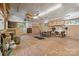 A large garage space with concrete floors and multiple windows, with worktables and storage at 2923 Meadow Creek Ln, Monroe, NC 28110
