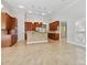 Large kitchen with wood cabinets, tile floors and large island at 2923 Meadow Creek Ln, Monroe, NC 28110