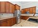 A modern kitchen with granite countertops and a stainless steel refrigerator provides ample space at 2923 Meadow Creek Ln, Monroe, NC 28110