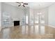 Bright living room featuring fireplace, tile floors, natural light and access to the yard at 2923 Meadow Creek Ln, Monroe, NC 28110