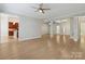 Hardwood living room with entryway to kitchen and ample natural light at 2923 Meadow Creek Ln, Monroe, NC 28110