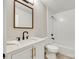 Bright bathroom features a white vanity, modern sink, framed mirror, and tiled shower-tub combo at 3120 Parkway Ave, Charlotte, NC 28208