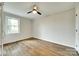Bedroom featuring a ceiling fan and hardwood floors with a view to the outdoors at 3120 Parkway Ave, Charlotte, NC 28208