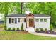 Charming renovated home with a brick exterior, updated landscaping and a welcoming front porch at 3120 Parkway Ave, Charlotte, NC 28208