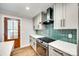 Updated kitchen featuring new cabinets, quartz countertops, stainless steel appliances and modern fixtures at 3120 Parkway Ave, Charlotte, NC 28208