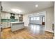 Bright kitchen boasts modern appliances, green backsplash, and an island with seating at 3120 Parkway Ave, Charlotte, NC 28208
