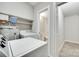 Bright laundry room features washer, dryer, water heater, and convenient access to an adjacent bathroom at 3120 Parkway Ave, Charlotte, NC 28208