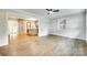 Open-concept room with hardwood floors, recessed lights, ceiling fan and lots of space at 3120 Parkway Ave, Charlotte, NC 28208