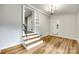 Living Room features a chandelier, hardwood floors, and stairs leading to an upper level at 3120 Parkway Ave, Charlotte, NC 28208