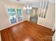 Dining area with hardwood floors, decorative lighting, and direct access to the outdoor patio at 3203 Oakdale Dr, Monroe, NC 28110