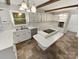 Traditional-style kitchen with white cabinets, an island cooktop, and stainless steel appliances at 3203 Oakdale Dr, Monroe, NC 28110